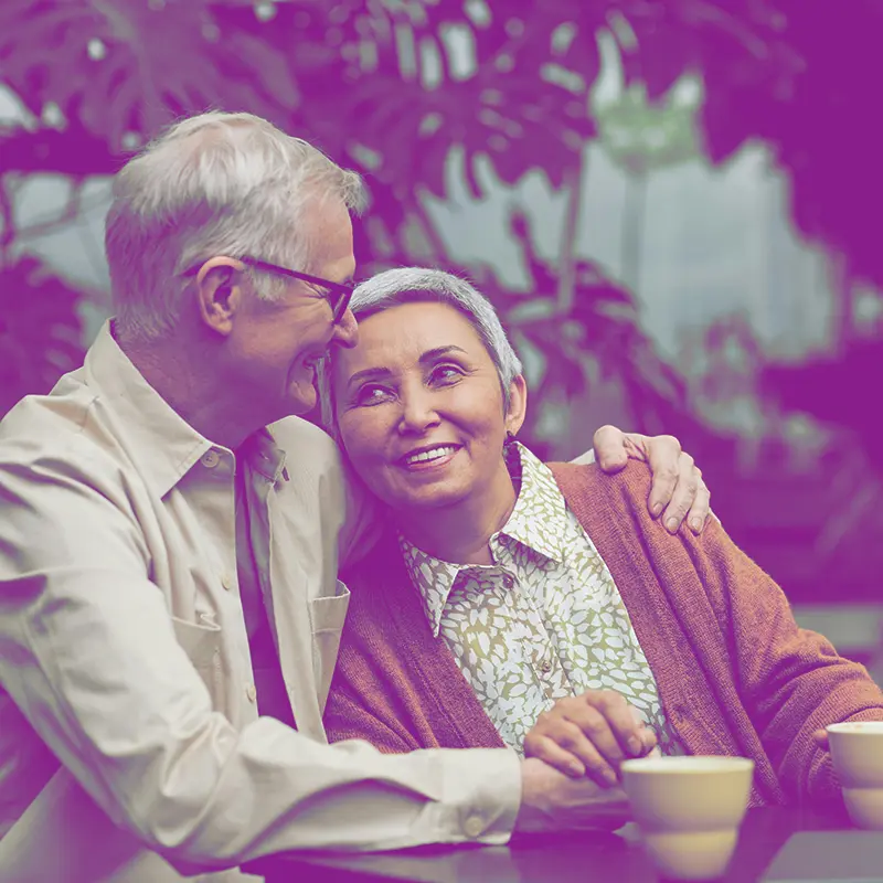 Mature couple sitting in the park after Christian counseling services in Tampa