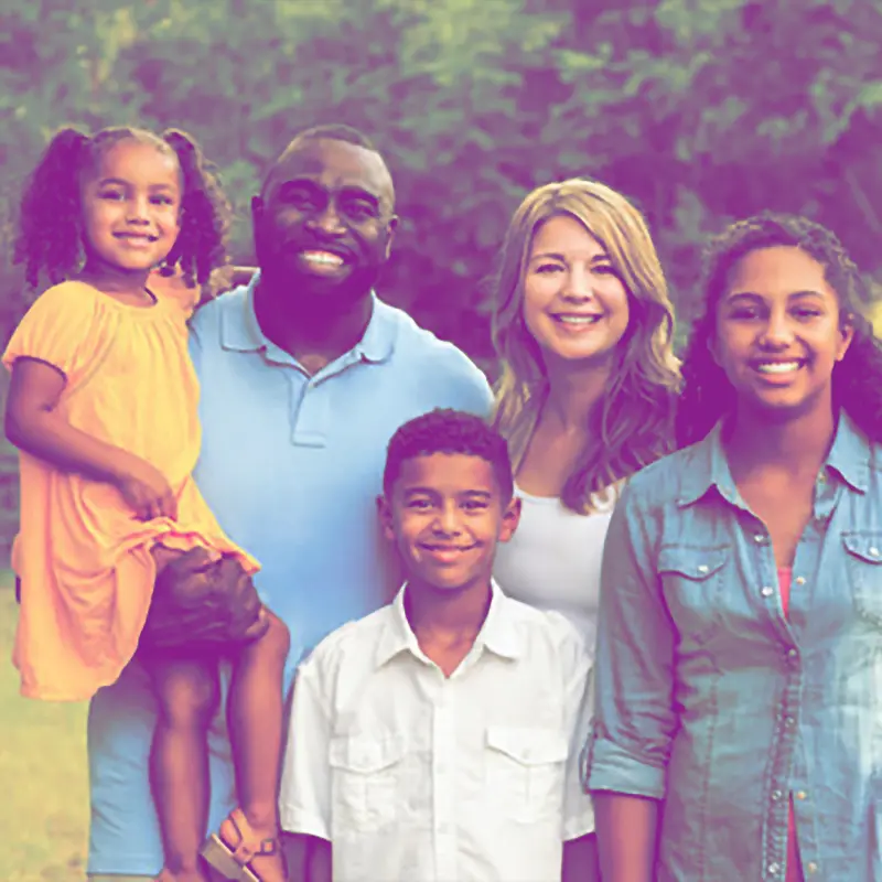 Happy mixed race family outdoors